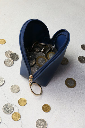 top view of coins in a small leather bagの写真素材