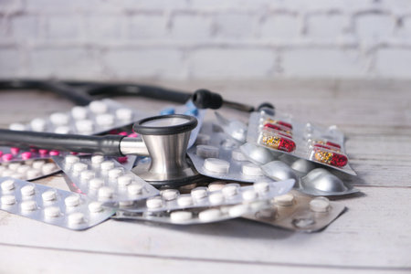 blister pack and stethoscope on white backgroundの写真素材