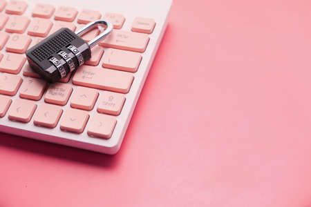 internet safety concept with padlocked on computer keyboardの写真素材