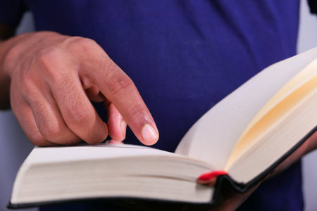 Close up of women hand turning a pager of a diary