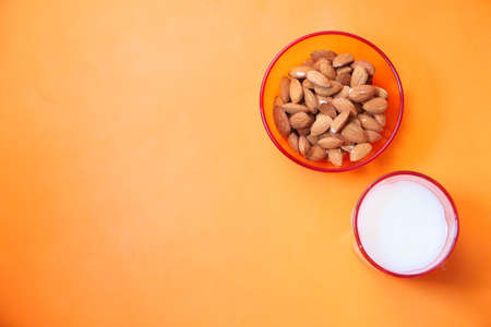 almond nut and milk on color background , top downの写真素材