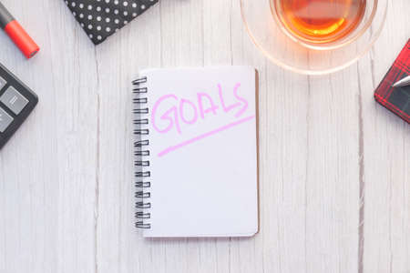 top view of new year goals text on notepad.の写真素材
