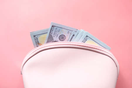 Close up of cash in wallet on pink background .の写真素材