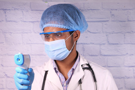 doctor hand with thermometer check temperature.