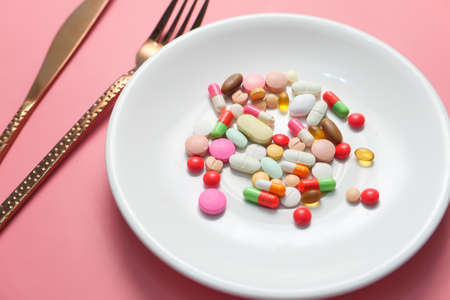 close up of colorful pills on plateの写真素材