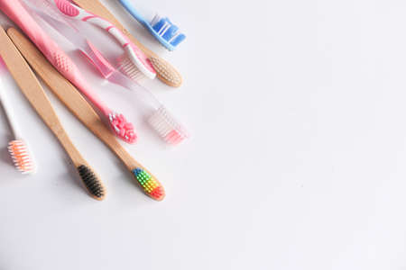 colorful toothbrushes on white background with copy spaceの写真素材