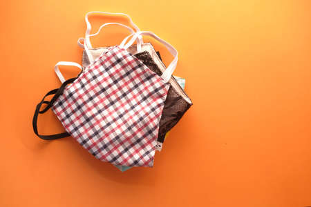 homemade face masks on orange background top downの写真素材