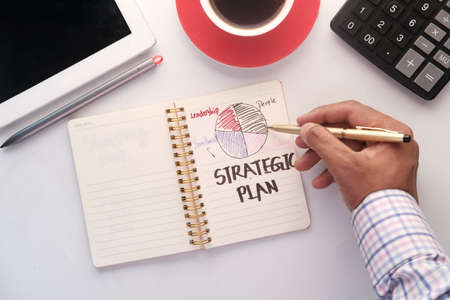 hand written growth chart on notepad at office deskの写真素材