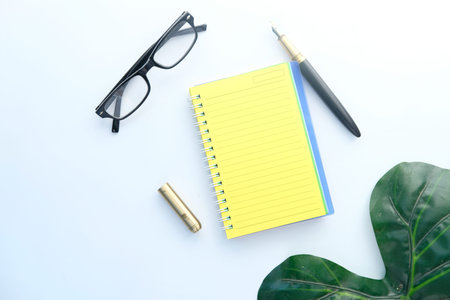 high angle view of open notepad on white background