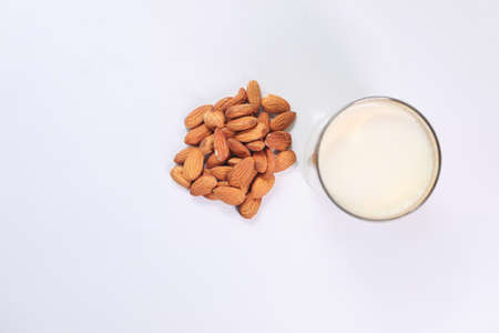 almond nut and milk on table top downの写真素材