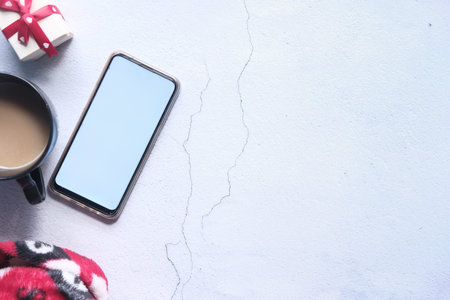 flat composition of smart phone and coffee on tableの写真素材