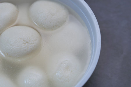 close up of indian sweet in a bowl on table.