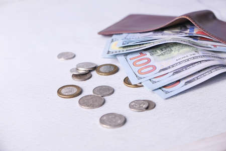 Close up of cash in wallet on table.の写真素材