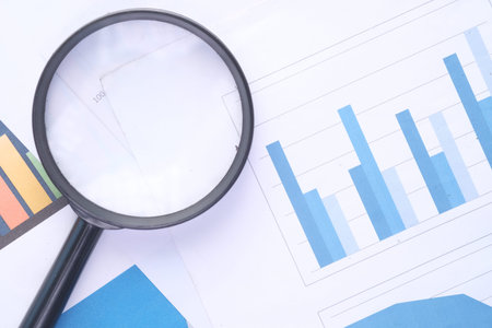 financial graph, magnifying glass on tableの写真素材