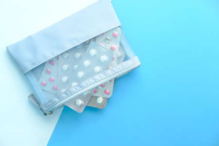 top view of blister pack in a bag on color backgroundの写真素材