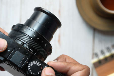 hand holding vintage camera close upの写真素材