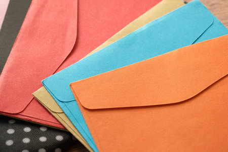 colorful envelope on wooden background with copy space.