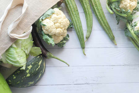 Healthy food with paper reusable bag vegetables on white background..の写真素材