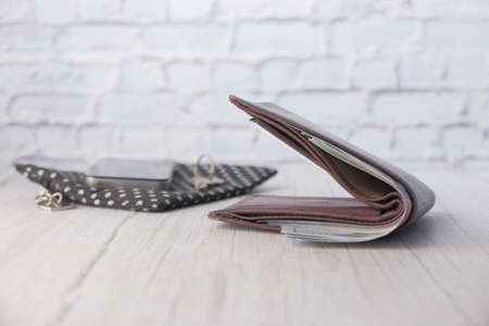Close up of cash in wallet on table.の写真素材