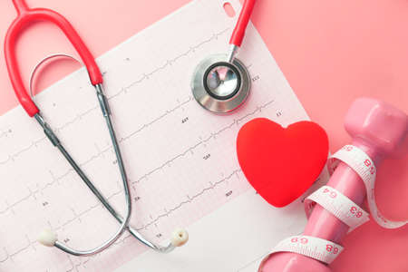 stethoscope and heart on a cardio diagram.の写真素材