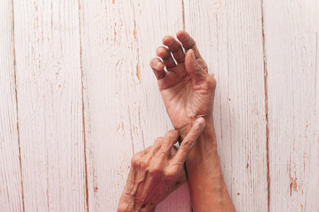 Elderly woman suffering from pain, Top view