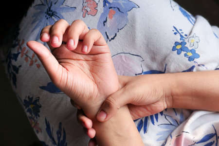 Young women hands suffering wrist pain, top viewの写真素材