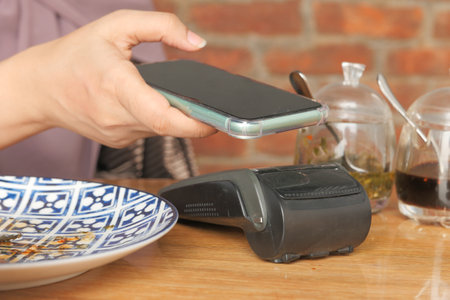 Payment terminal charging from a smart phone, contactless payment.の写真素材