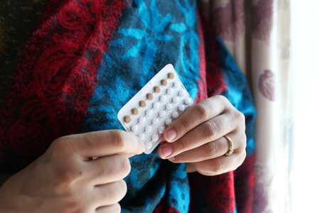 women hand golding birth control pills close upの写真素材