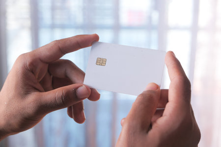 hand holding credit cards reading informationの写真素材
