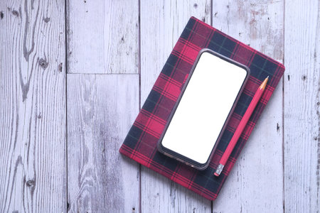 smart phone with empty screen on notepadの写真素材