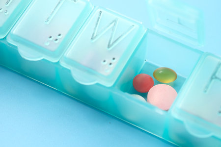 close up of pills and capsule in a pill boxの写真素材