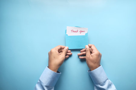 man hand reading a thank you letterの写真素材