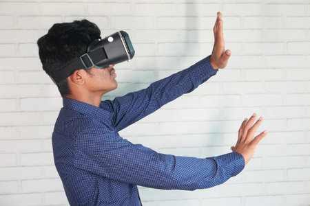 young man wearing virtual reality headset, vr box.