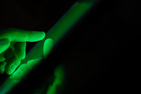 Close up of hacker hand stealing data from digital tabletの写真素材