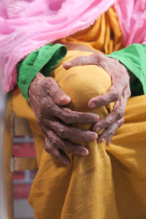 Close up on senior women suffering knee joint painの写真素材