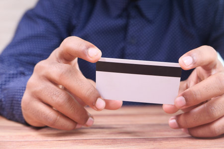 hand holding credit cards reading informationの写真素材