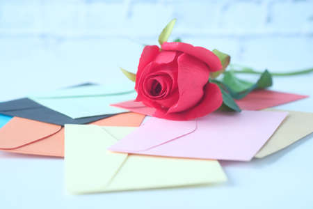 many envelope and rose flower on white backgroundの写真素材