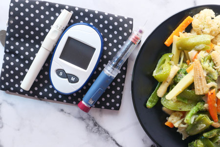 diabetic measurement tools and insulin pen and healthy food on tableの写真素材