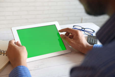 businessman using digital tablet on office deskの写真素材