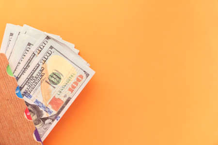 Close up of 100 dollar cash on tableの写真素材