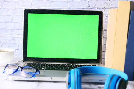 laptop with blank screen on office desk.の写真素材