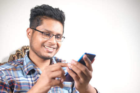 happy young man hand using smart phone.
