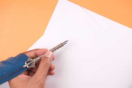 Close up of man hand writing a letter with fountain pen