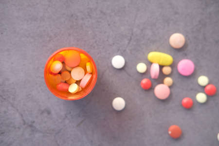 Close up of many colorful pills and capsulesの写真素材