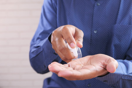 Using sanitizer liquid for preventing corona virusの写真素材