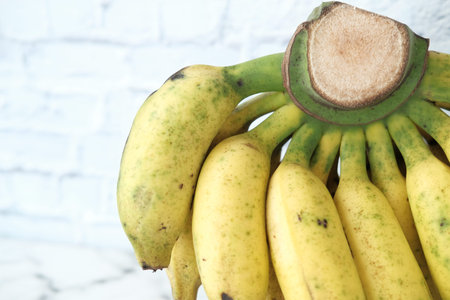 Close up of fresh banana in a bowl on table .の写真素材