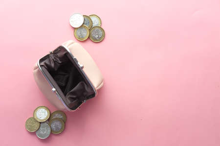 top view of coins in a small leather bagの写真素材