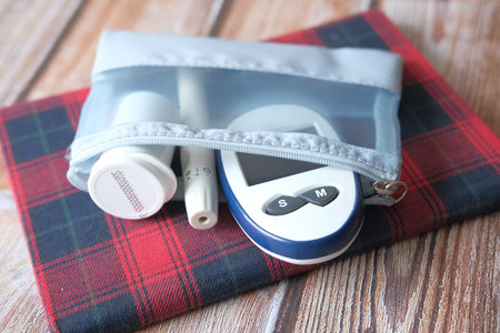 Close up of diabetic measurement tools in small bag