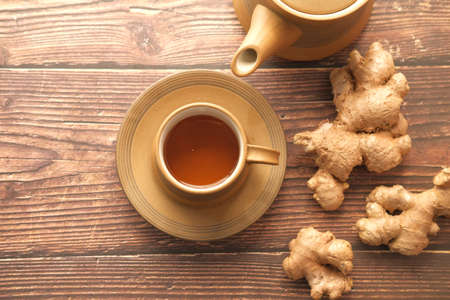 Top view of ginger tea on wooden background.の写真素材