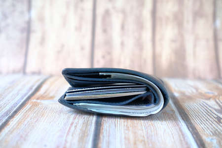 Close up of cash in wallet on table.の写真素材